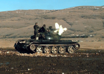 Members of the Croatian Defense Council (HVO) Army, 2nd Guard Brigade, fire the 12.7mm machine gun, mounted on a T-55 main battle tank during a three-day exercise when the HVO Army was granted use of Barbara Range for the first time in 18 months. (Duplicate image, see also DD-SD-01-05146 or search 980110-F-7866P-502)