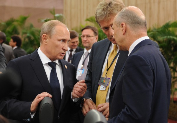 epa04317363 Russian President Vladimir Putin (C) speaks with Russian Finance Minister Anton Siluanov (R) and and the President's Press Secretary Dmitry Peskov (2-R) during the 6th BRICS summit in the city of Fortaleza, Brazil, 15 July 2014. The heads of the BRICS (Brazil, Russia, India, China and South Africa) member states discuss political coordination issues and global governance problems.  EPA/MIKHAIL KLIMENTYEV / RIA NOVOSTI / KREMLIN POOL MANDATORY CREDIT
